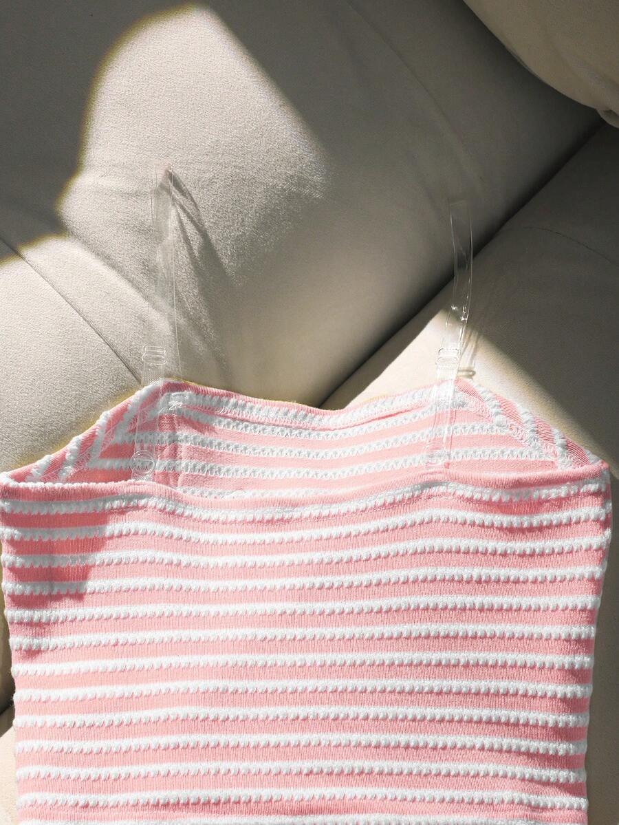 Tween girls black and white striped two-piece set featuring a spaghetti strap micro crop tank top with lettuce trim and ruffle hem paired with matching slim fit shorts.