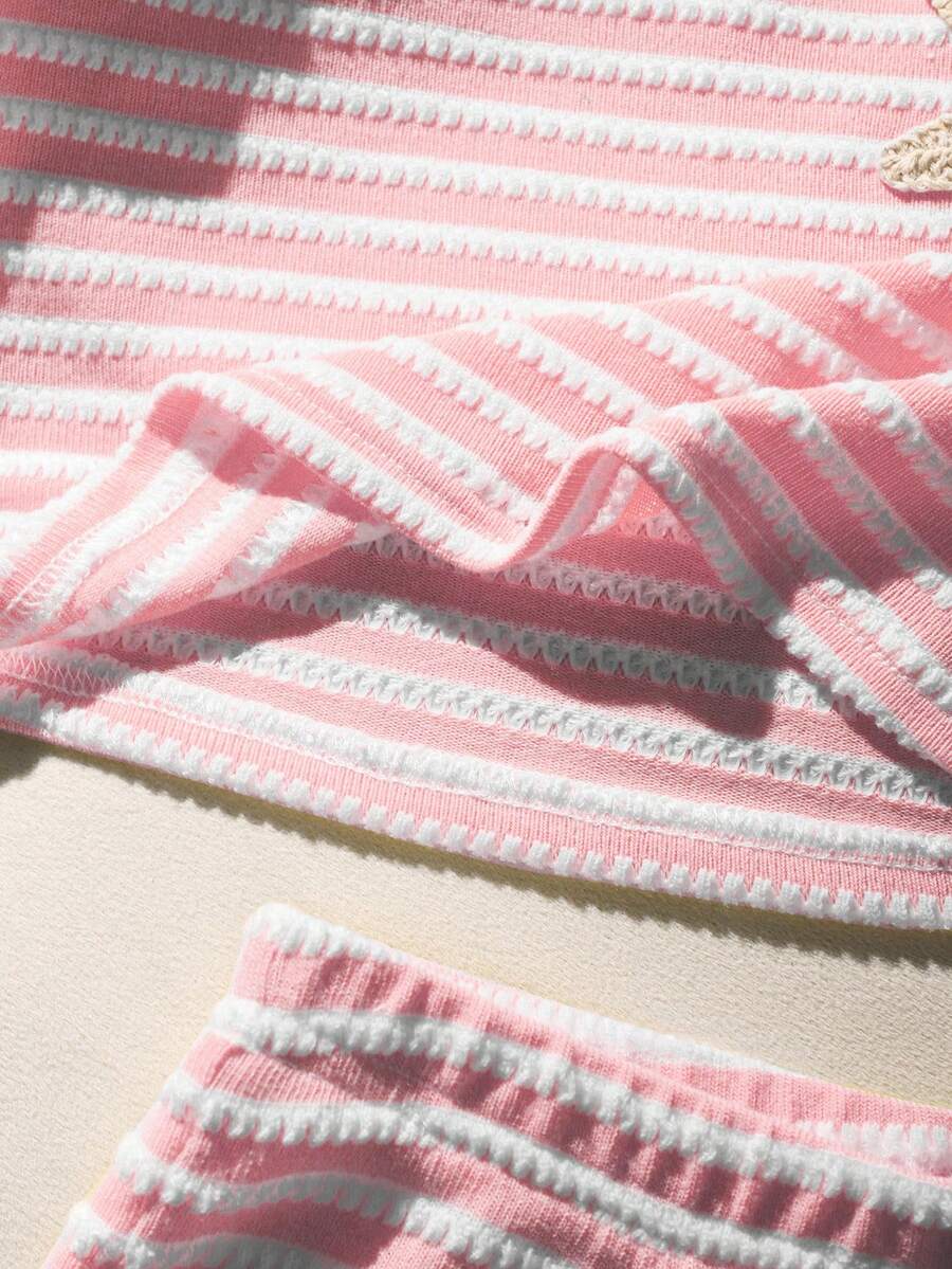 Tween girls black and white striped two-piece set featuring a spaghetti strap micro crop tank top with lettuce trim and ruffle hem paired with matching slim fit shorts.