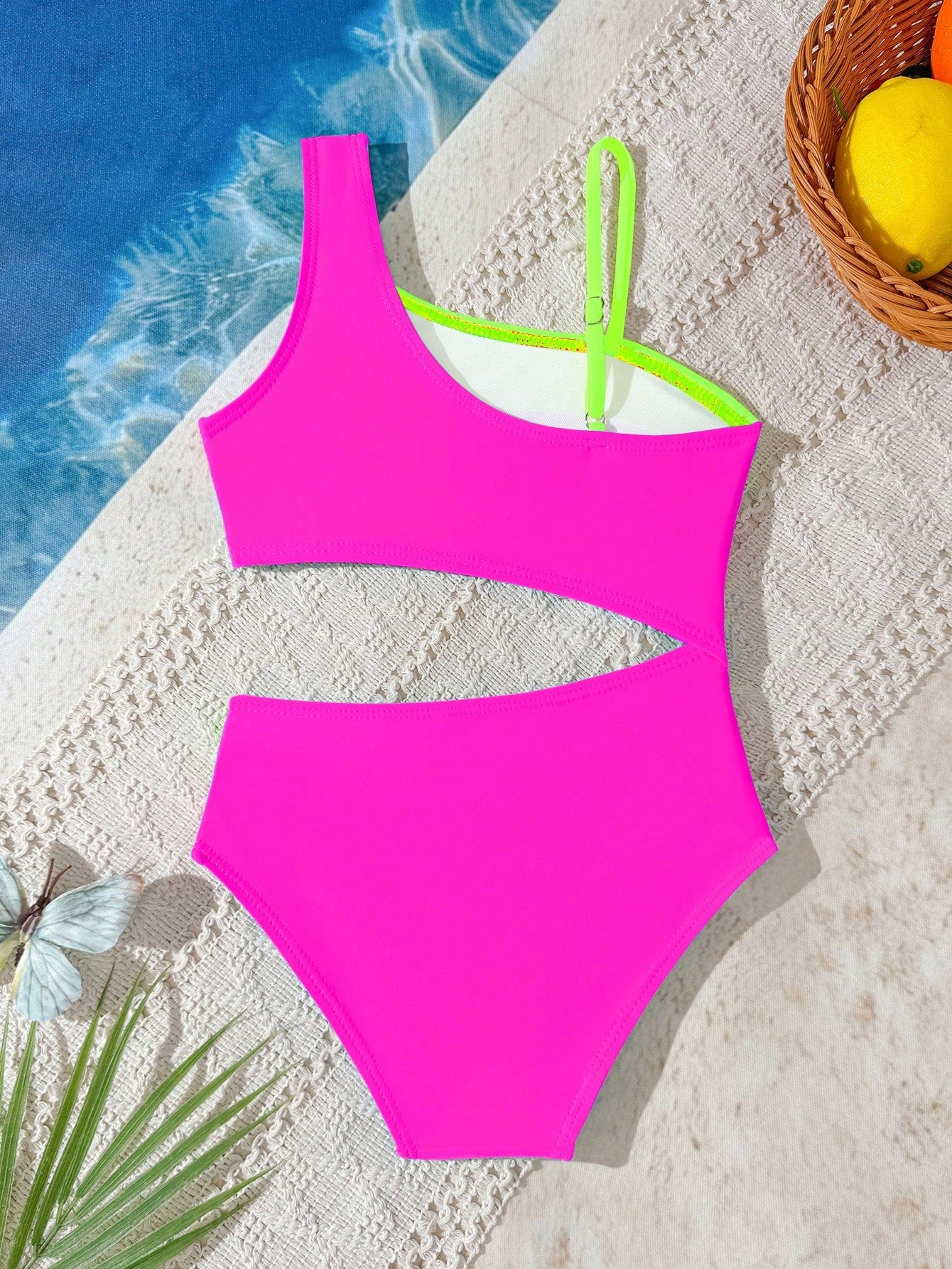 Black one-piece swimsuit for tween girls with cut out detail, spaghetti straps, high waist bottom, wireless bra, and fitted vacation swimwear style.