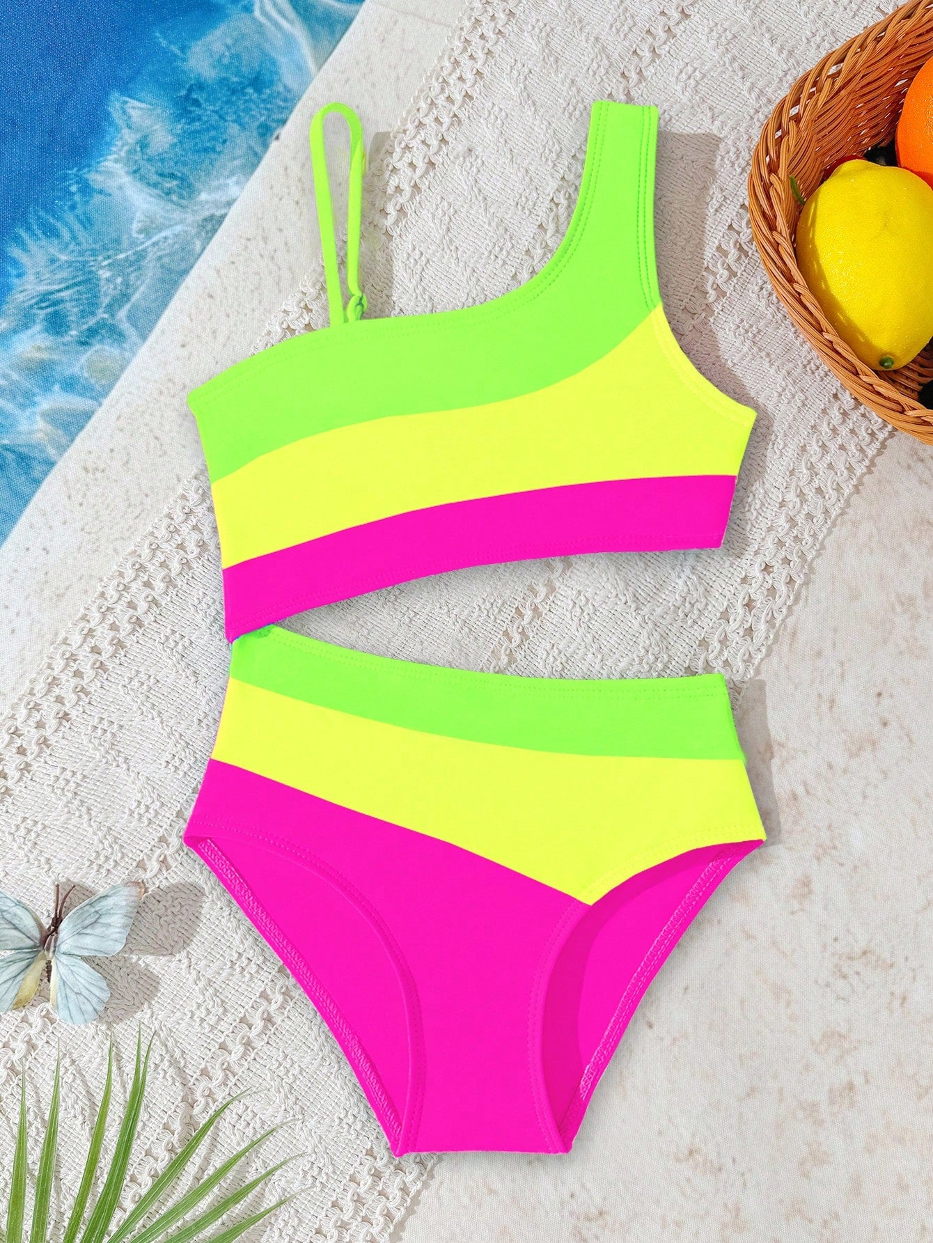 Black one-piece swimsuit for tween girls with cut out detail, spaghetti straps, high waist bottom, wireless bra, and fitted vacation swimwear style.