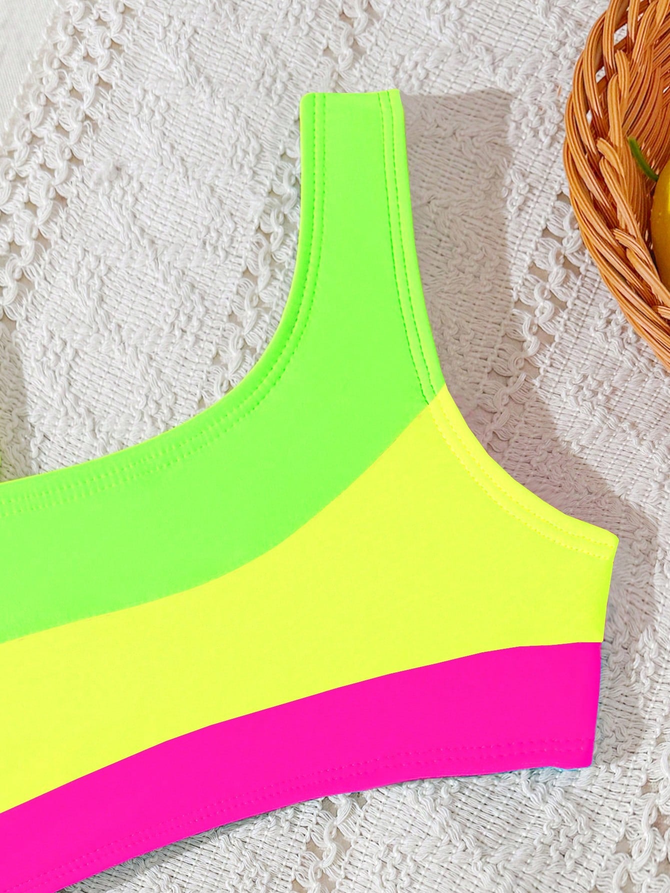 Black one-piece swimsuit for tween girls with cut out detail, spaghetti straps, high waist bottom, wireless bra, and fitted vacation swimwear style.