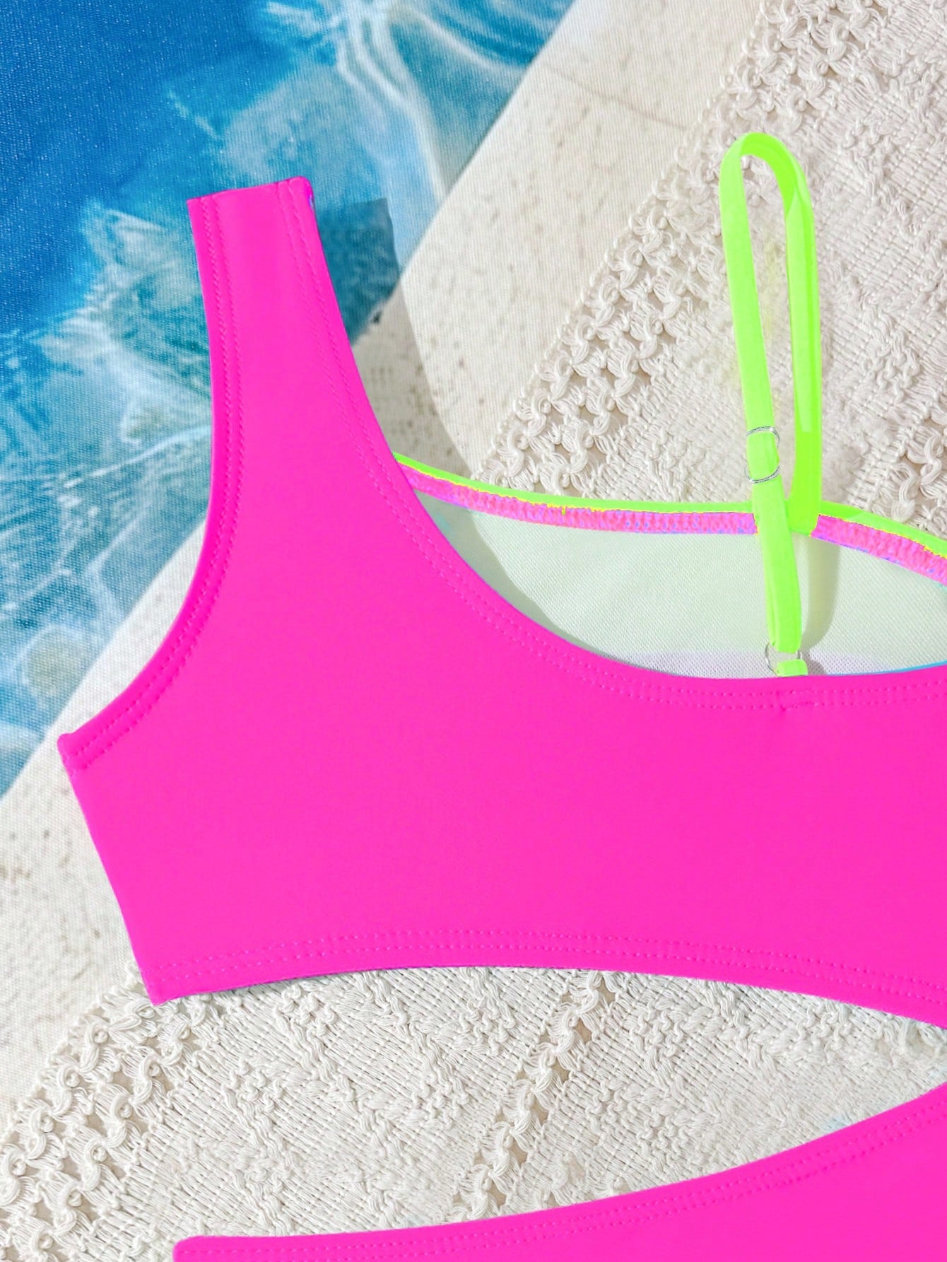 Black one-piece swimsuit for tween girls with cut out detail, spaghetti straps, high waist bottom, wireless bra, and fitted vacation swimwear style.