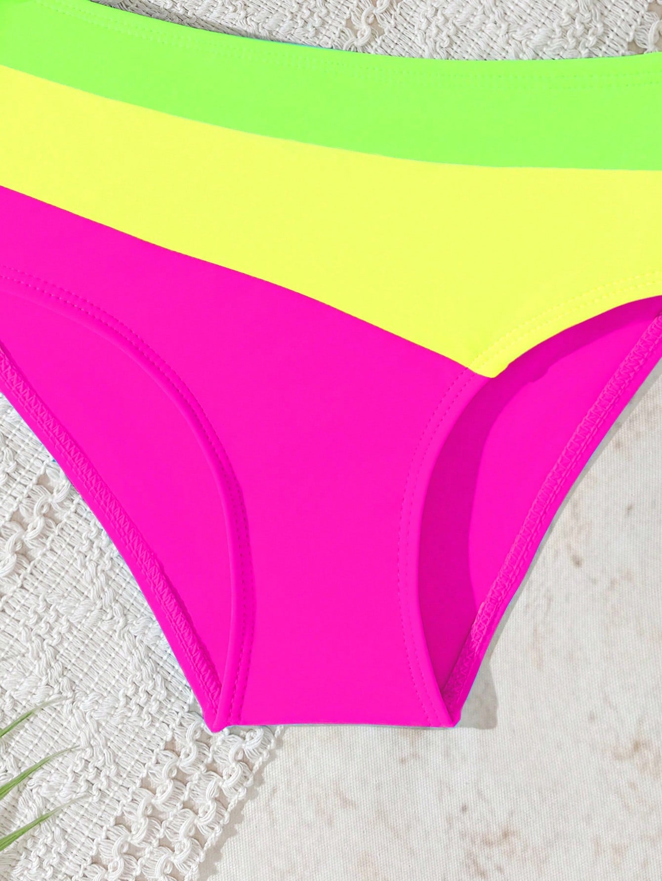 Black one-piece swimsuit for tween girls with cut out detail, spaghetti straps, high waist bottom, wireless bra, and fitted vacation swimwear style.