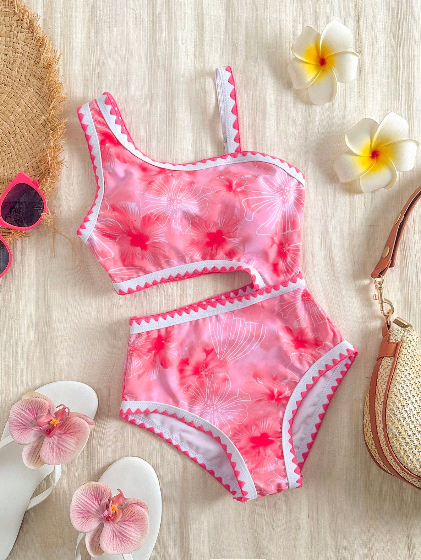 Tween girls one-piece swimsuit featuring an asymmetric neckline, pendant decor, plain design, wireless bra, high-cut bottom, and medium-stretch fabric.