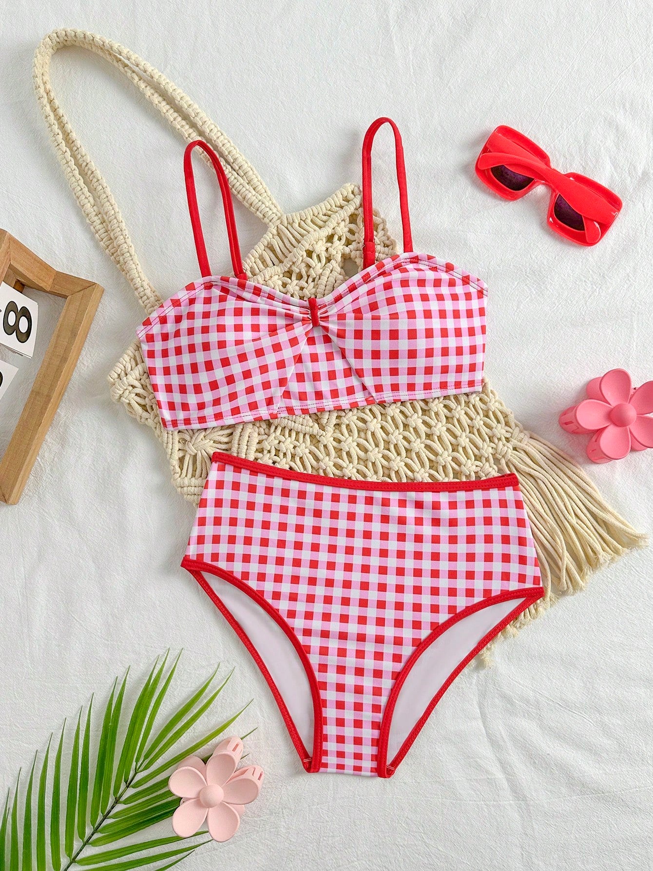 Tween girls 2-piece ditsy floral bikini set featuring a spaghetti strap top with center string detail and matching bottoms with side strings, designed for swimming, vacation, and summer wear.