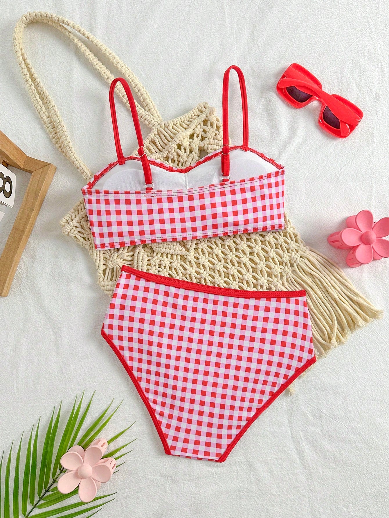 Tween girls 2-piece ditsy floral bikini set featuring a spaghetti strap top with center string detail and matching bottoms with side strings, designed for swimming, vacation, and summer wear.