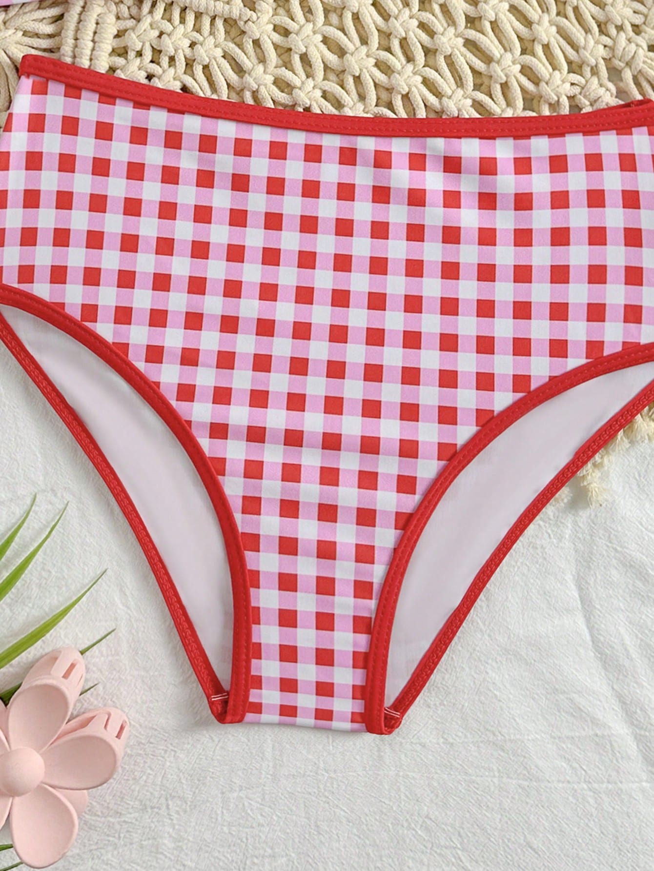 Tween girls 2-piece ditsy floral bikini set featuring a spaghetti strap top with center string detail and matching bottoms with side strings, designed for swimming, vacation, and summer wear.