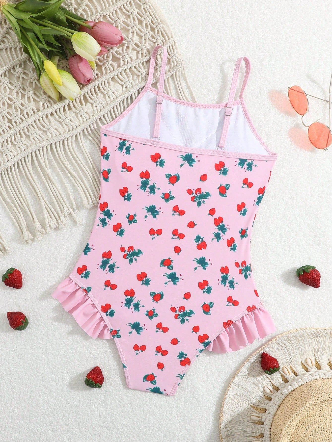 Tween girl plaid all-over print one-piece swimsuit with ruffle detail, spaghetti straps, fitted shape, and multicolor patchwork style for beach or pool wear.
