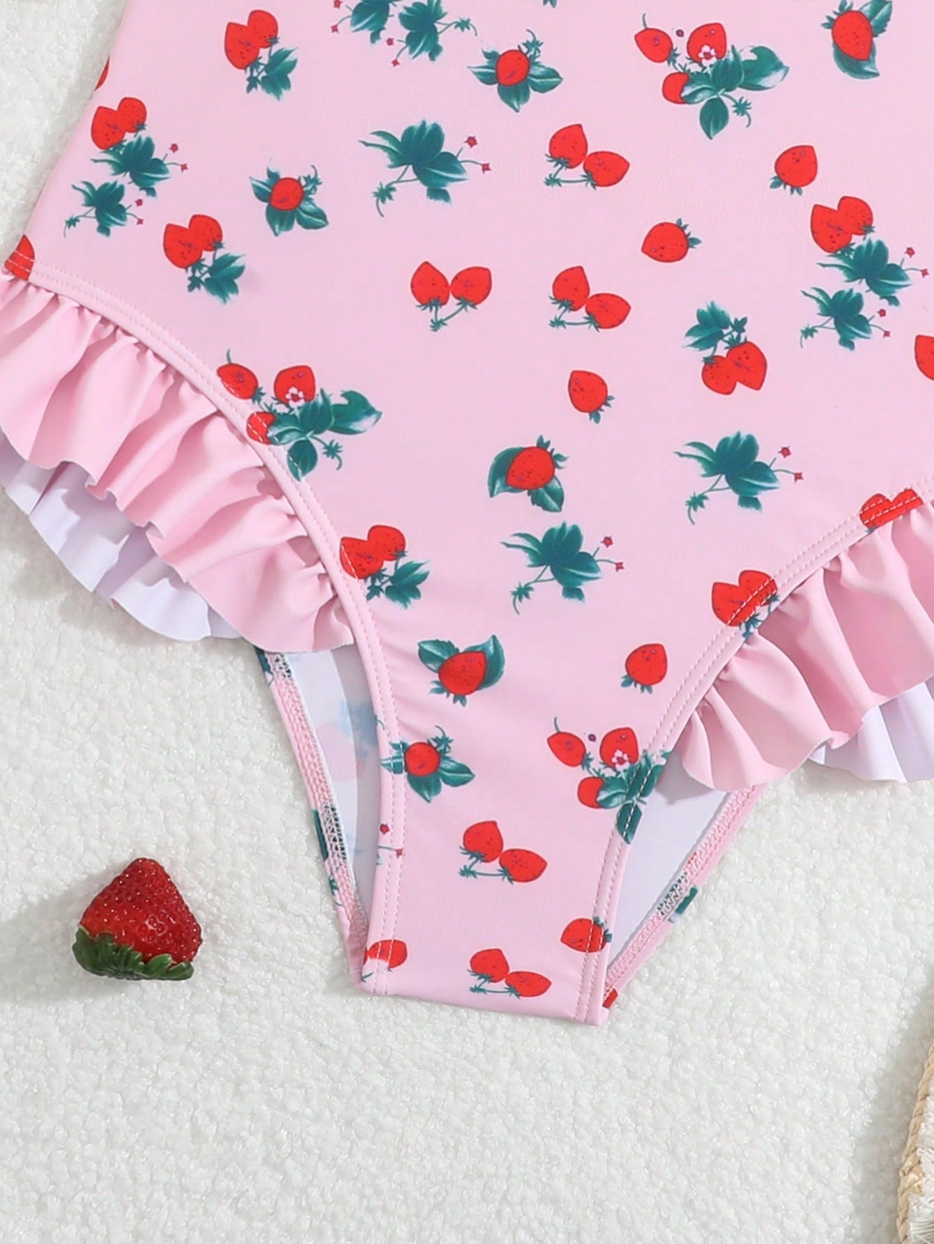 Tween girl plaid all-over print one-piece swimsuit with ruffle detail, spaghetti straps, fitted shape, and multicolor patchwork style for beach or pool wear.
