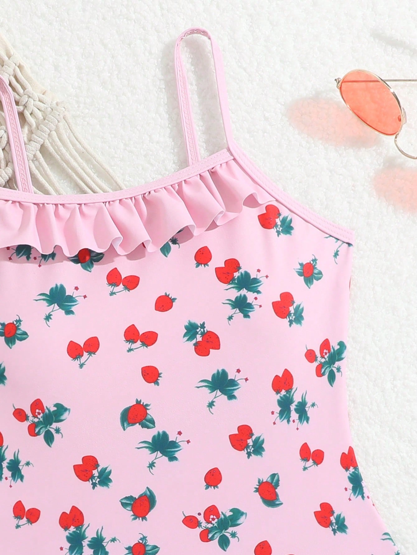 Tween girl plaid all-over print one-piece swimsuit with ruffle detail, spaghetti straps, fitted shape, and multicolor patchwork style for beach or pool wear.
