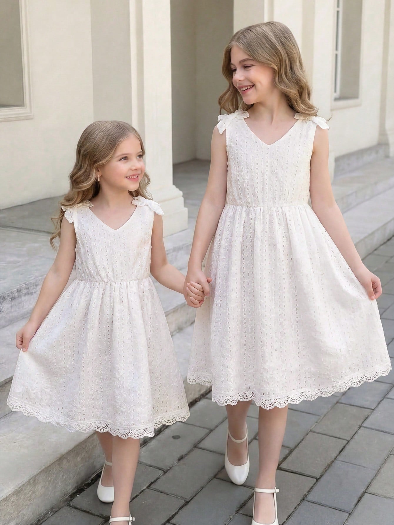 Girls sleeveless blue tiered dress featuring a V-neckline, high waist, and A-line skirt.
