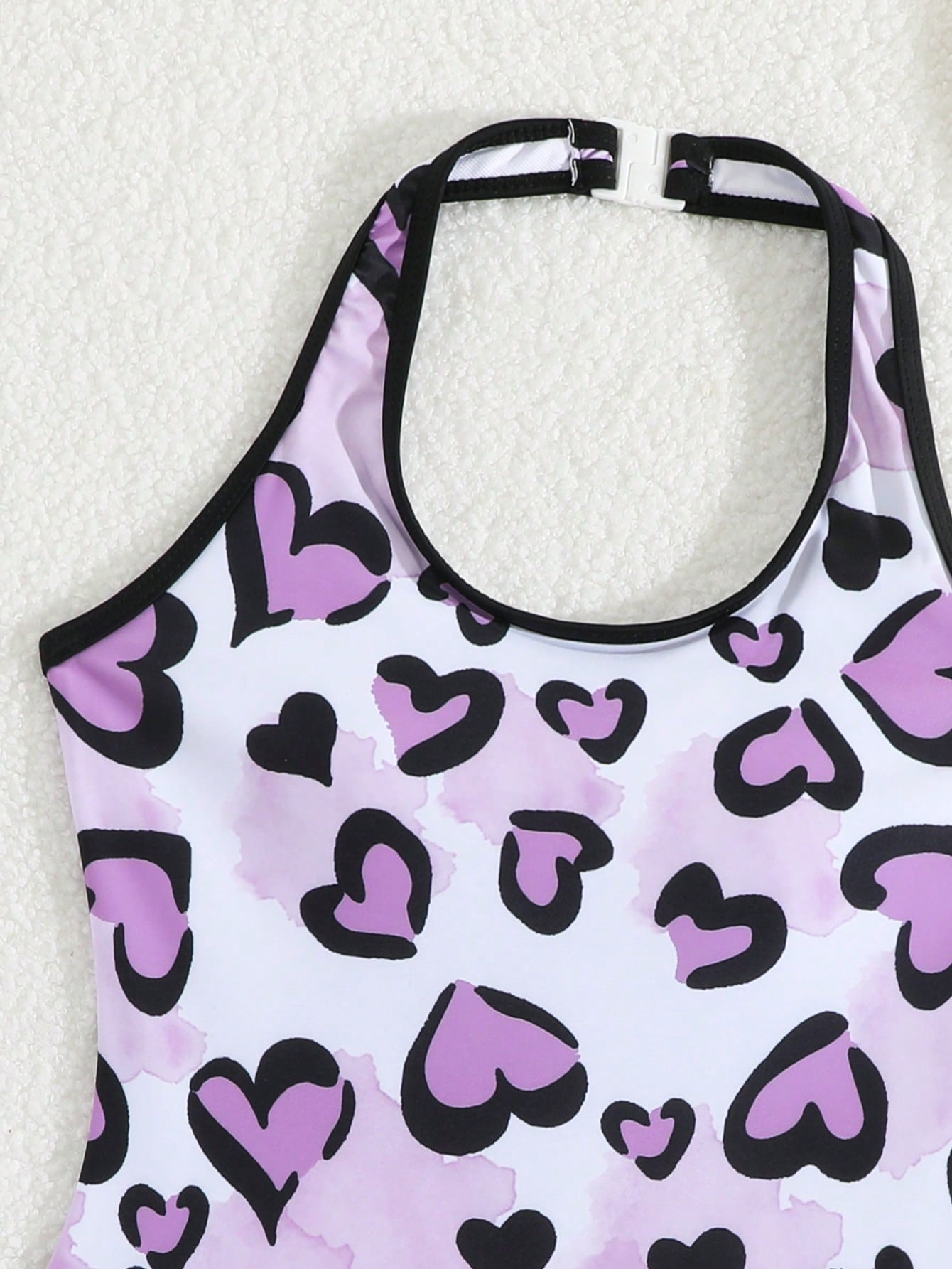 Girls 2-piece swimwear set featuring a butterfly print halter swimsuit top with contrast piping and separate mid-waist shorts; sleeveless, high-stretch, wireless design for beach and vacation wear.