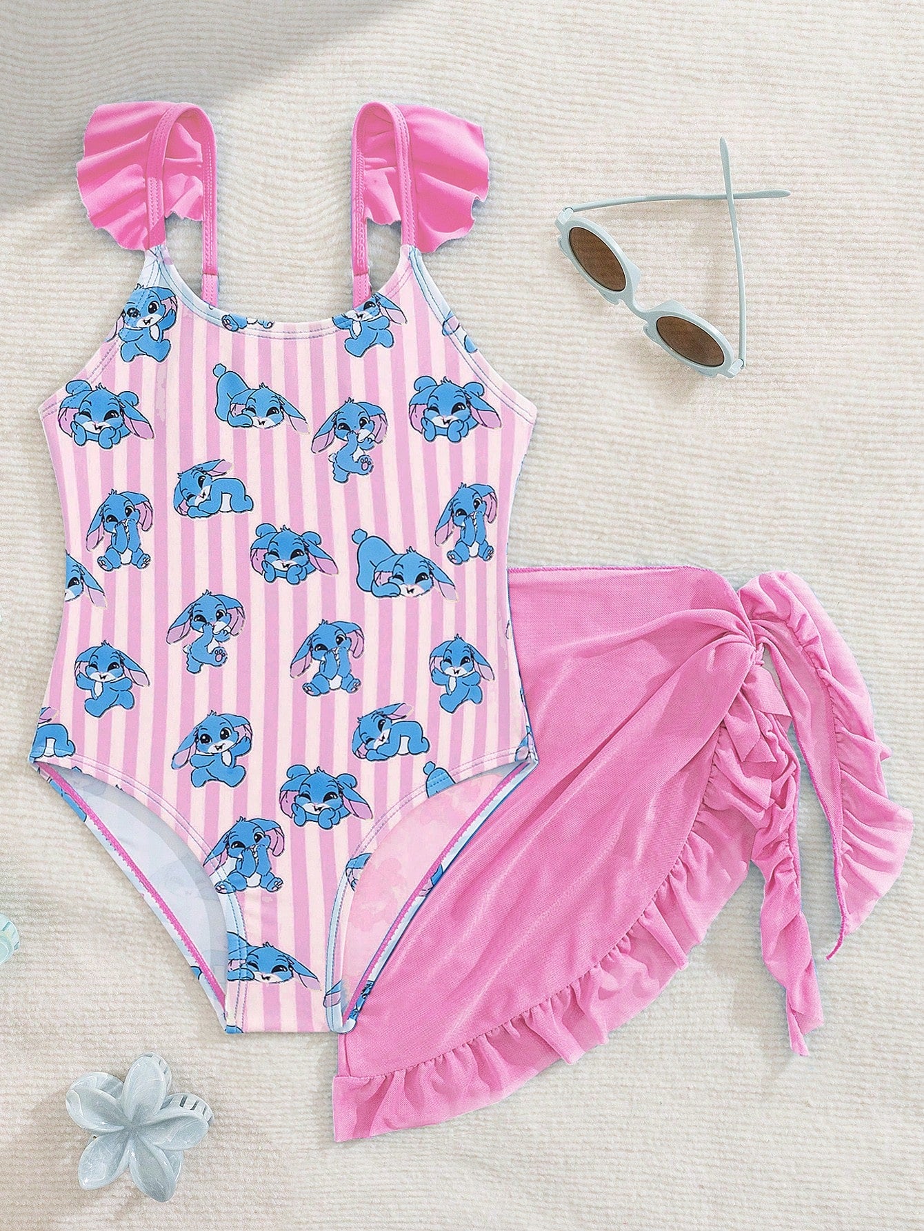 Tween girls one-piece swimsuit in leopard print with ruffle shoulder straps, scoop neckline, fitted shape, and attached ruffle hem skirt; sleeveless, mid-waist skirt bottom, and lined body for swimming, vacation, and summer beach wear.