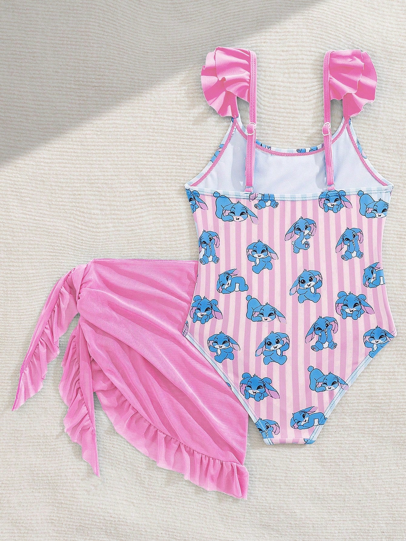 Tween girls one-piece swimsuit in leopard print with ruffle shoulder straps, scoop neckline, fitted shape, and attached ruffle hem skirt; sleeveless, mid-waist skirt bottom, and lined body for swimming, vacation, and summer beach wear.