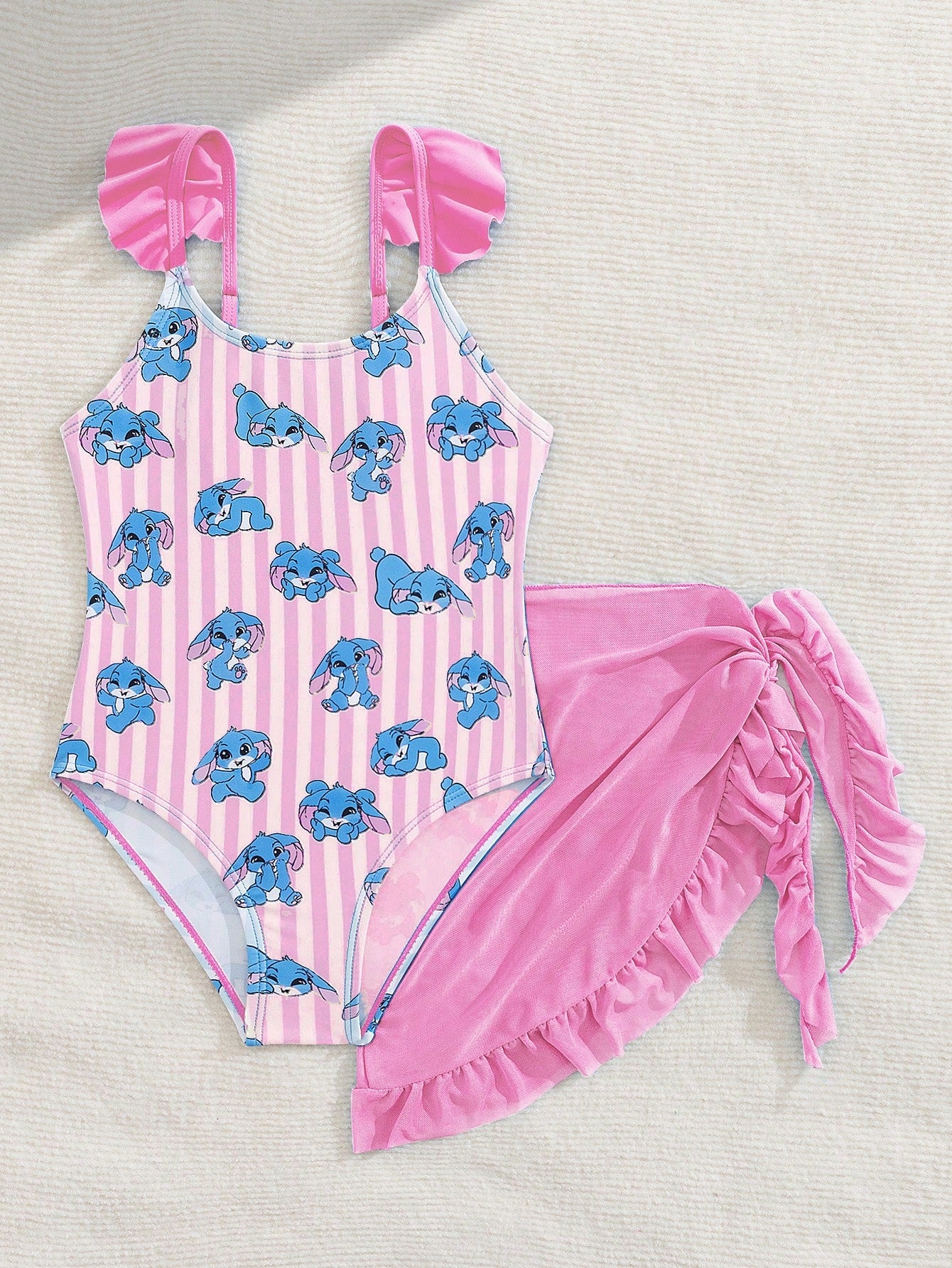 Tween girls one-piece swimsuit in leopard print with ruffle shoulder straps, scoop neckline, fitted shape, and attached ruffle hem skirt; sleeveless, mid-waist skirt bottom, and lined body for swimming, vacation, and summer beach wear.