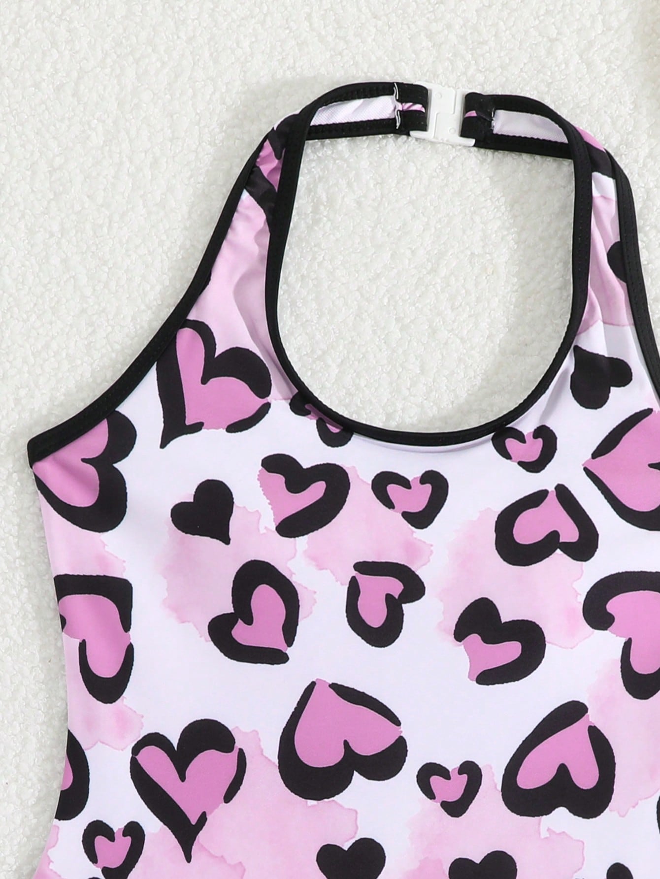 Girls 2-piece swimwear set featuring a butterfly print halter swimsuit top with contrast piping and separate mid-waist shorts; sleeveless, high-stretch, wireless design for beach and vacation wear.