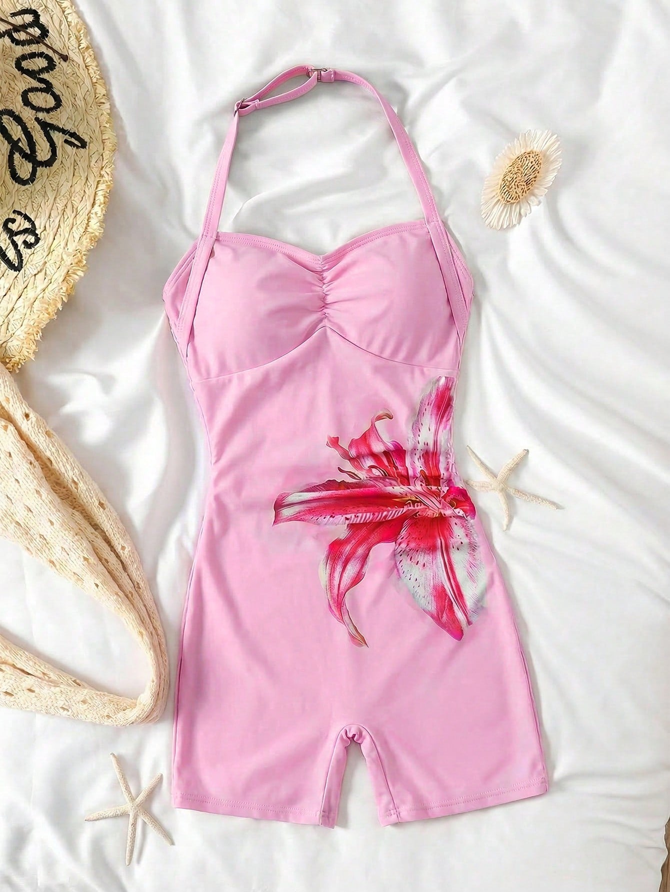 Apricot one-piece swimsuit for tween girls with a halter neckline, ruffle trim, textured knit fabric, fitted shape, and starfish metal decor.