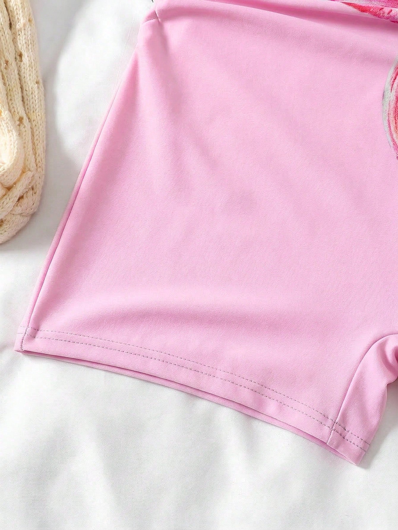 Apricot one-piece swimsuit for tween girls with a halter neckline, ruffle trim, textured knit fabric, fitted shape, and starfish metal decor.