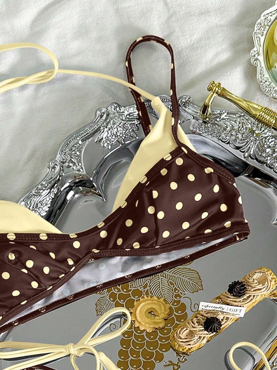 Women's retro polka dot high waist bikini swimsuit set with spaghetti straps and knot tie-back top.