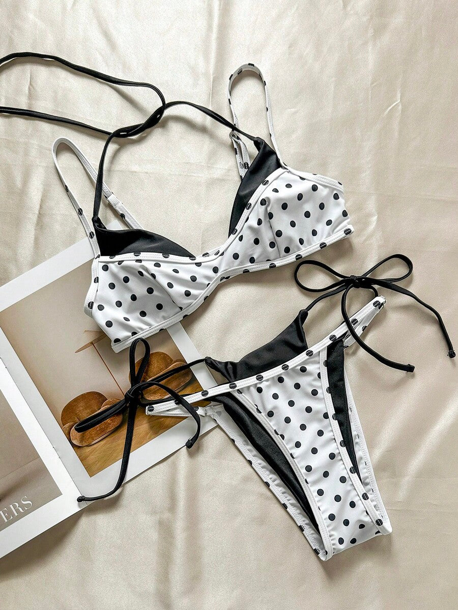 Women's retro polka dot high waist bikini swimsuit set with spaghetti straps and knot tie-back top.
