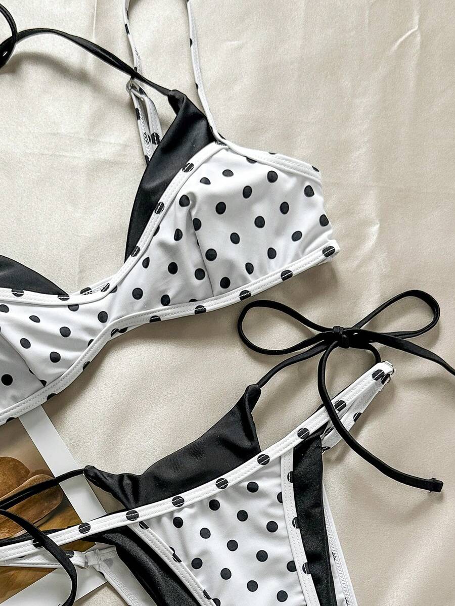 Women's retro polka dot high waist bikini swimsuit set with spaghetti straps and knot tie-back top.