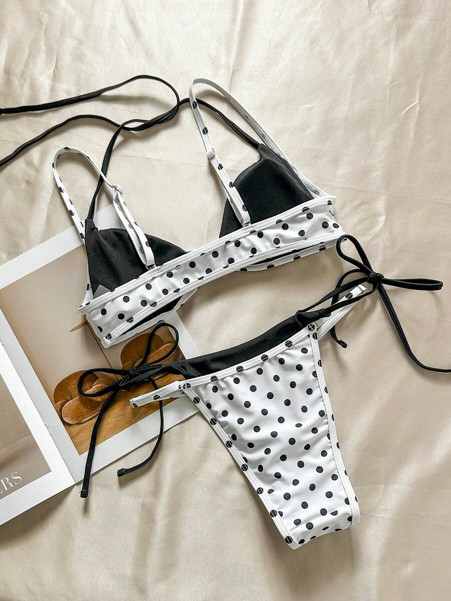 Women's retro polka dot high waist bikini swimsuit set with spaghetti straps and knot tie-back top.