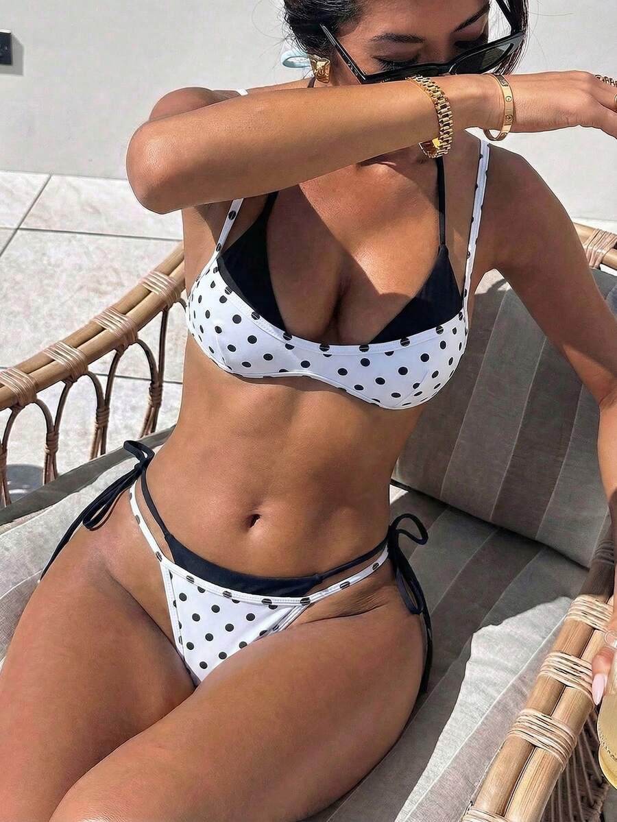 Women's retro polka dot high waist bikini swimsuit set with spaghetti straps and knot tie-back top.