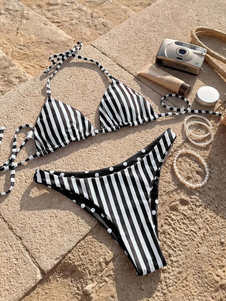Women's two-piece halter bikini set featuring high cut thong bottoms and removable padding