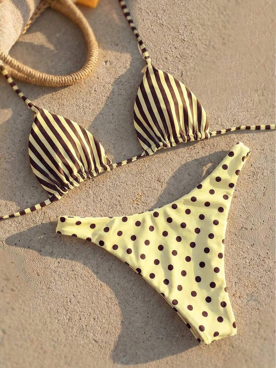 Women's two-piece halter bikini set featuring high cut thong bottoms and removable padding