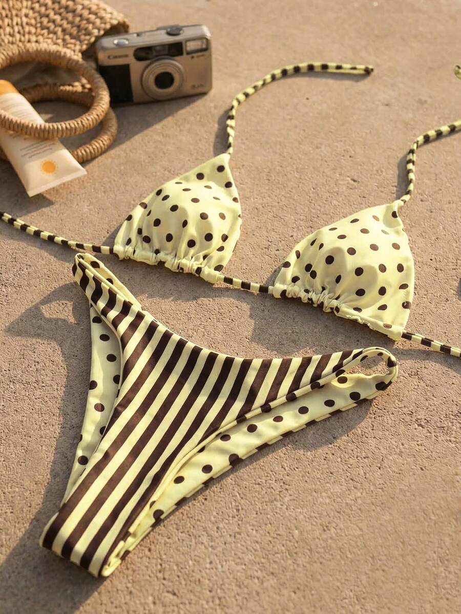 Women's two-piece halter bikini set featuring high cut thong bottoms and removable padding