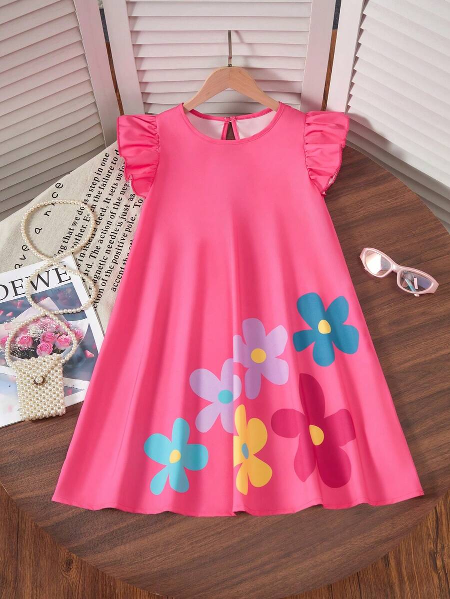 Tween girls sleeveless tropical floral mini dress in black with round neck and ruffle hem detail