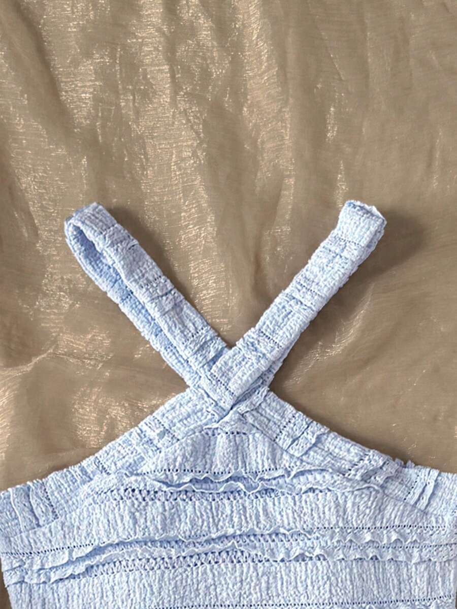 Tween girls blue and white 2-piece set with a striped halter neck vest top and a floral high-waist tiered paperbag skirt.