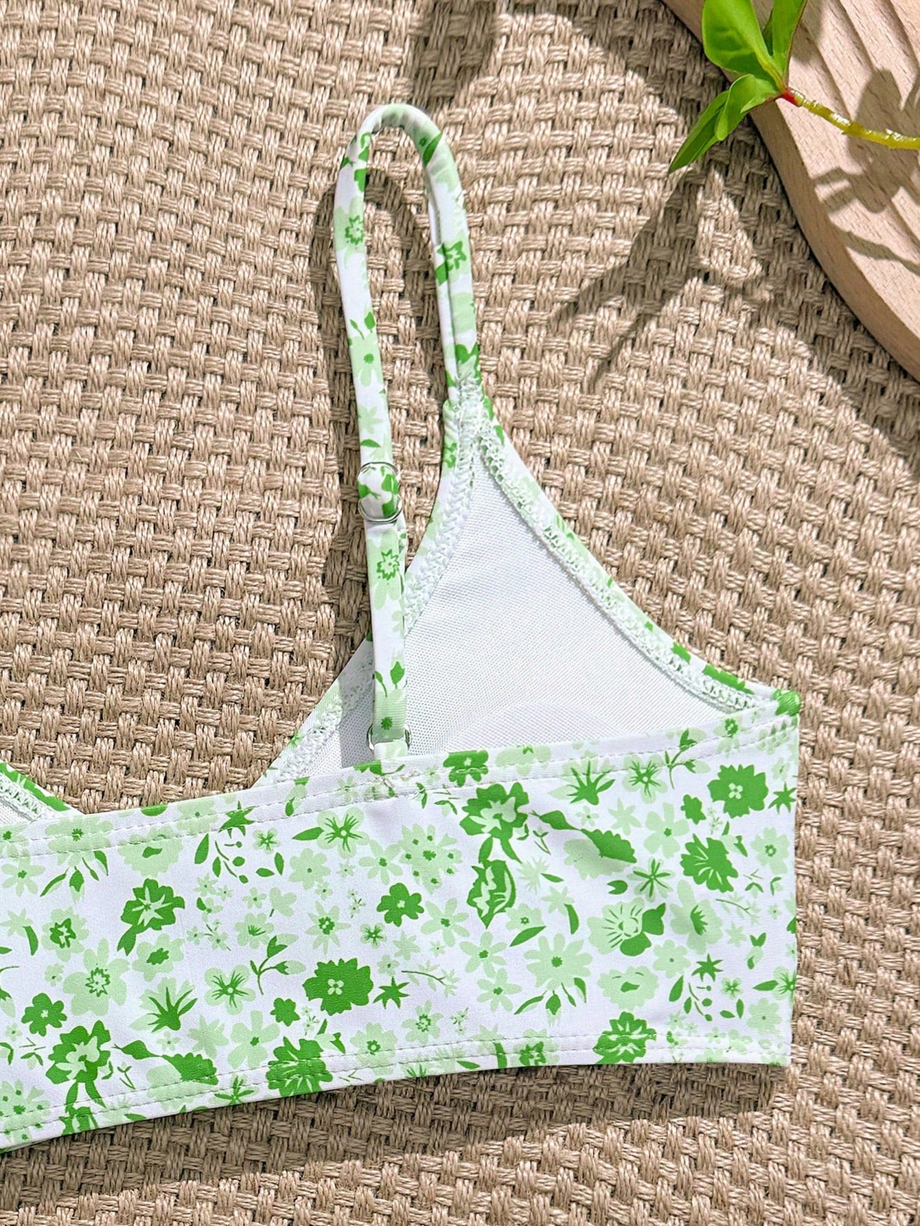 Tween girls 2-piece ditsy floral bikini set featuring a spaghetti strap top with center string detail and matching bottoms with side strings, designed for swimming, vacation, and summer wear.