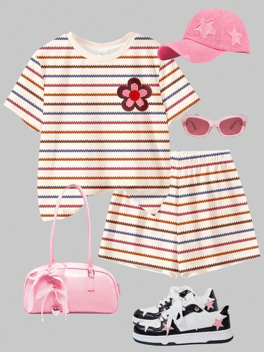 Tween girls multicolor tie-dye 2-piece outfit set featuring a drop-shoulder short-sleeve t-shirt and matching loose track shorts with side pockets.