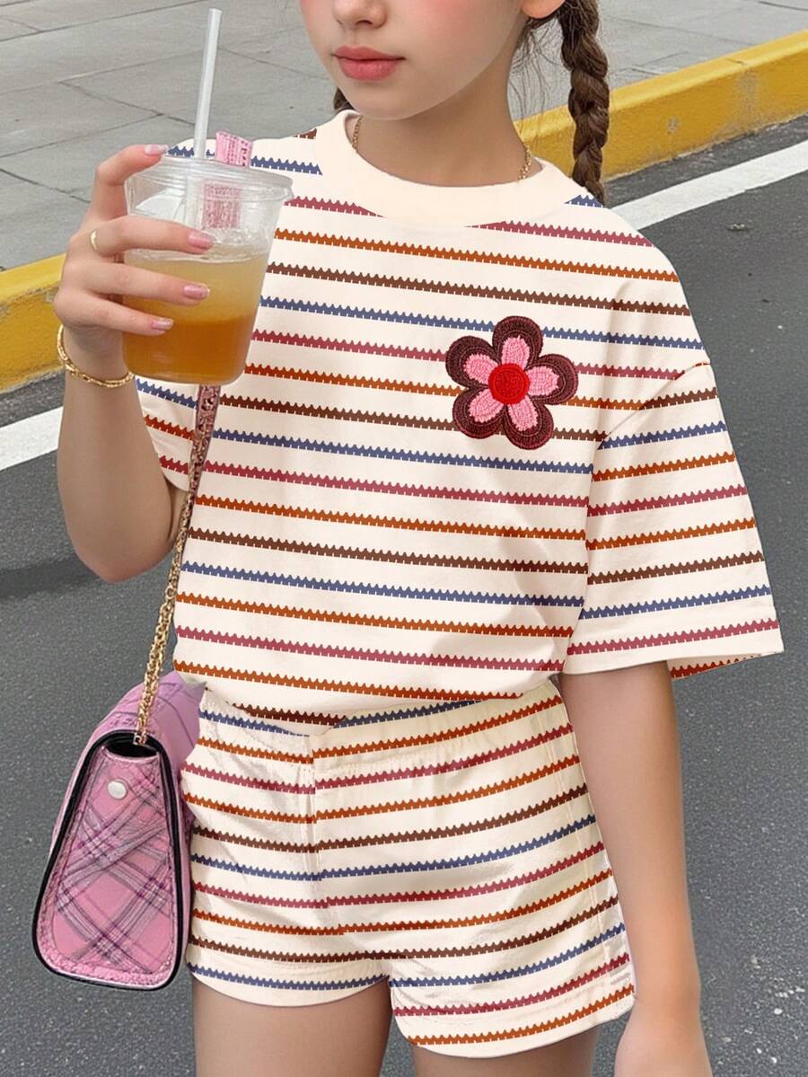 Tween girls multicolor tie-dye 2-piece outfit set featuring a drop-shoulder short-sleeve t-shirt and matching loose track shorts with side pockets.
