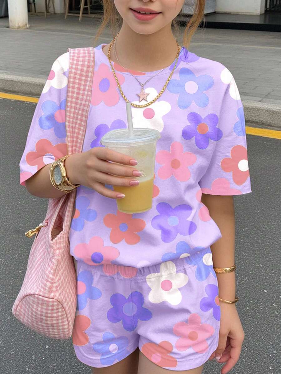 Tween girls multicolor tie-dye 2-piece outfit set featuring a drop-shoulder short-sleeve t-shirt and matching loose track shorts with side pockets.