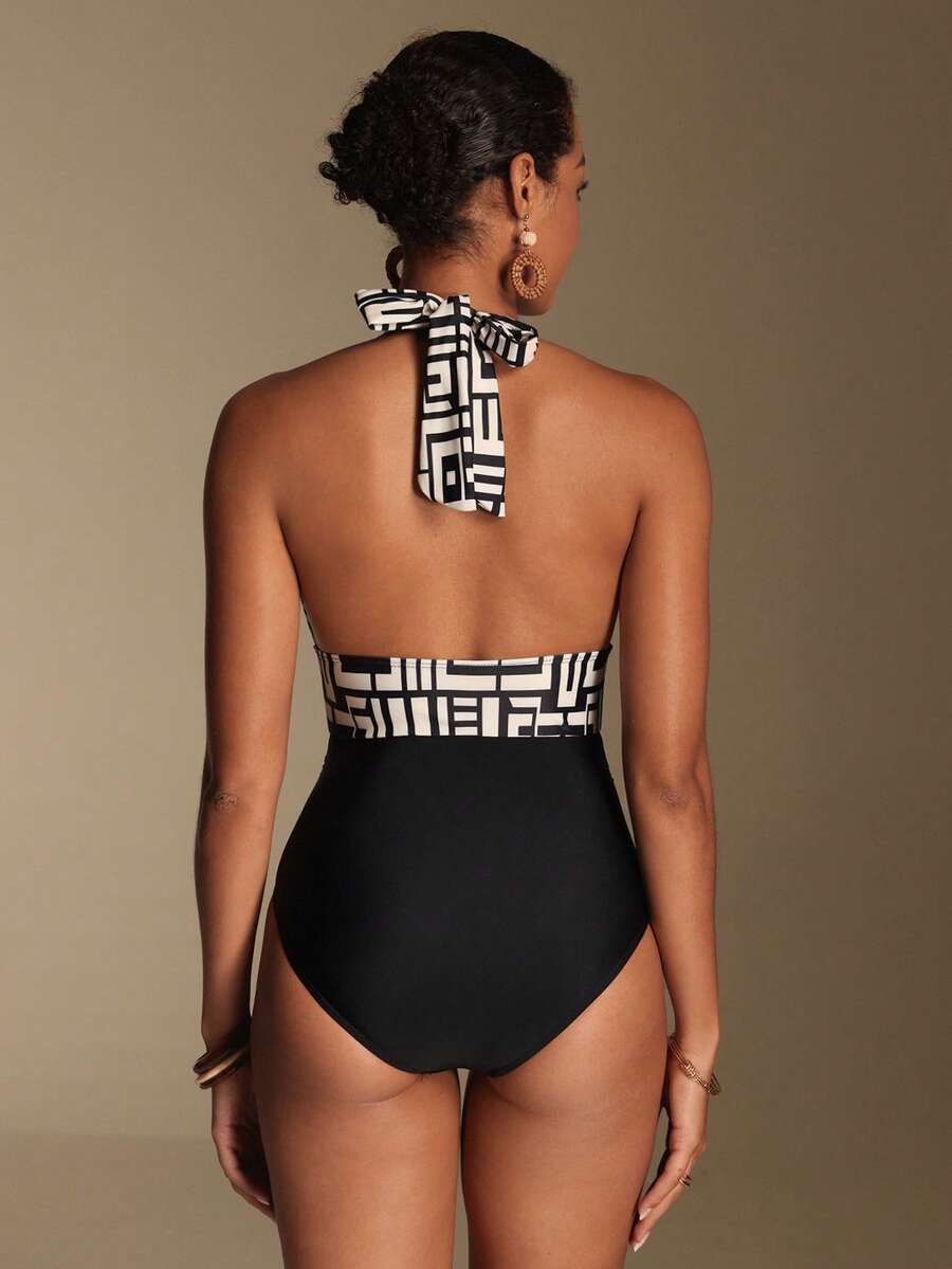 Apricot women's one-piece swimsuit featuring a halter neckline, backless tie-back detail, and ruched knitted fabric.
