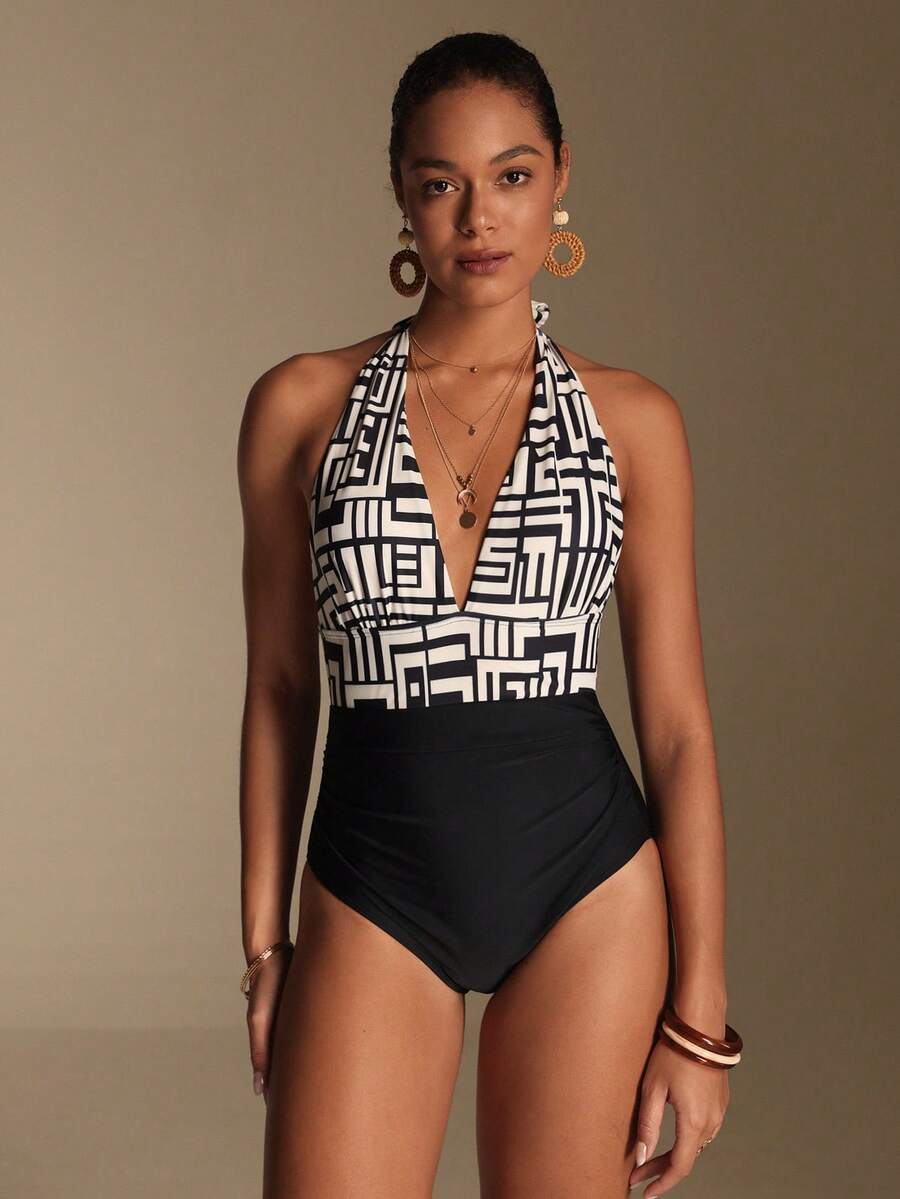 Apricot women's one-piece swimsuit featuring a halter neckline, backless tie-back detail, and ruched knitted fabric.