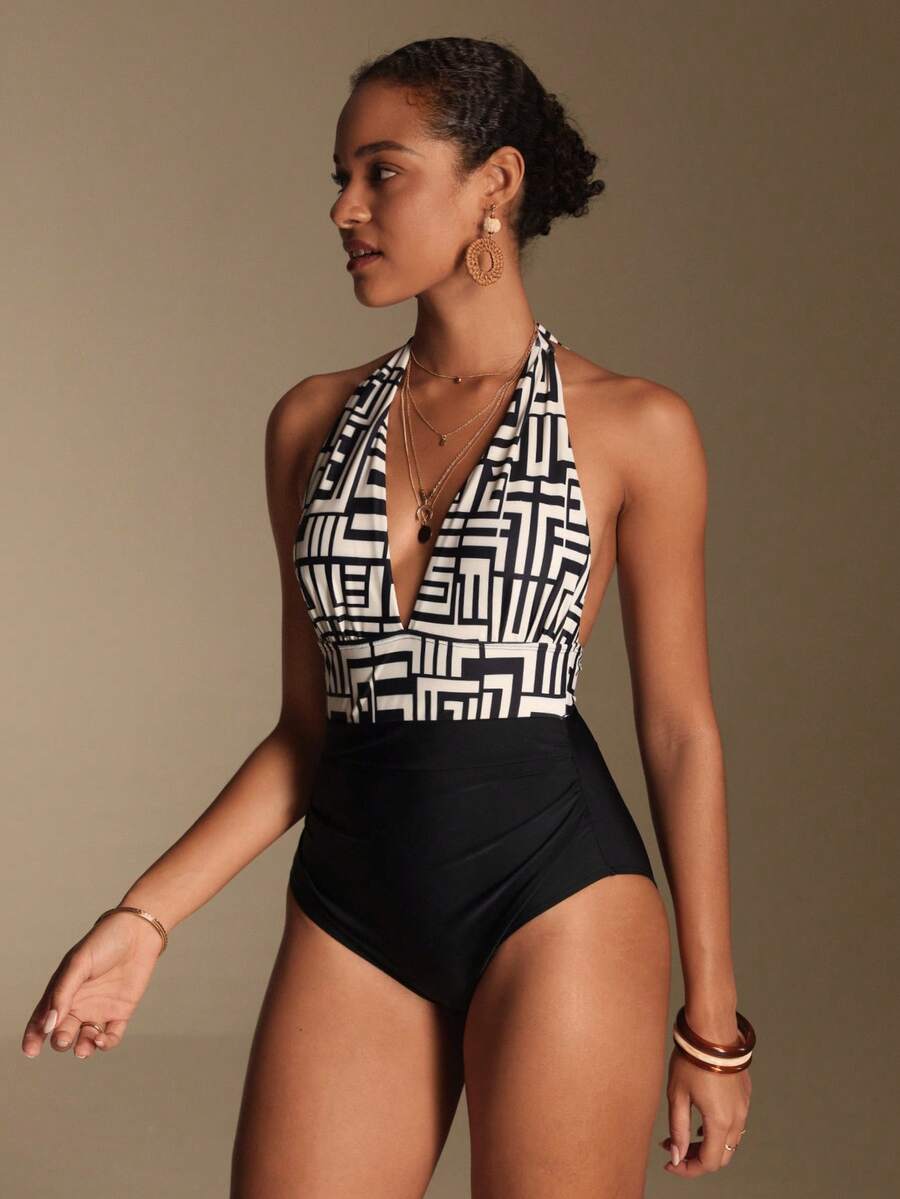 Apricot women's one-piece swimsuit featuring a halter neckline, backless tie-back detail, and ruched knitted fabric.