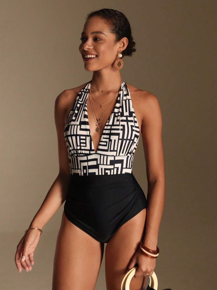 Apricot women's one-piece swimsuit featuring a halter neckline, backless tie-back detail, and ruched knitted fabric.