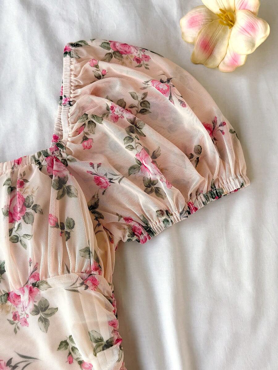 Teen girls red floral print A-line party dress featuring short puff sleeves, square neckline, ruched bust, and contrast lace details.