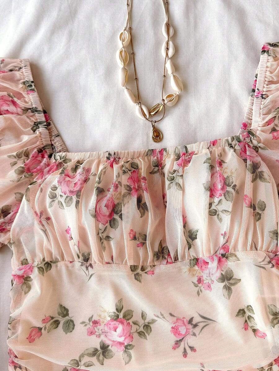 Teen girls red floral print A-line party dress featuring short puff sleeves, square neckline, ruched bust, and contrast lace details.