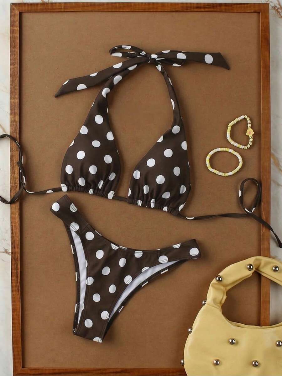 Women's halter neck bikini swimwear set featuring a wireless bra top with removable padding and mid waist bikini bottom.