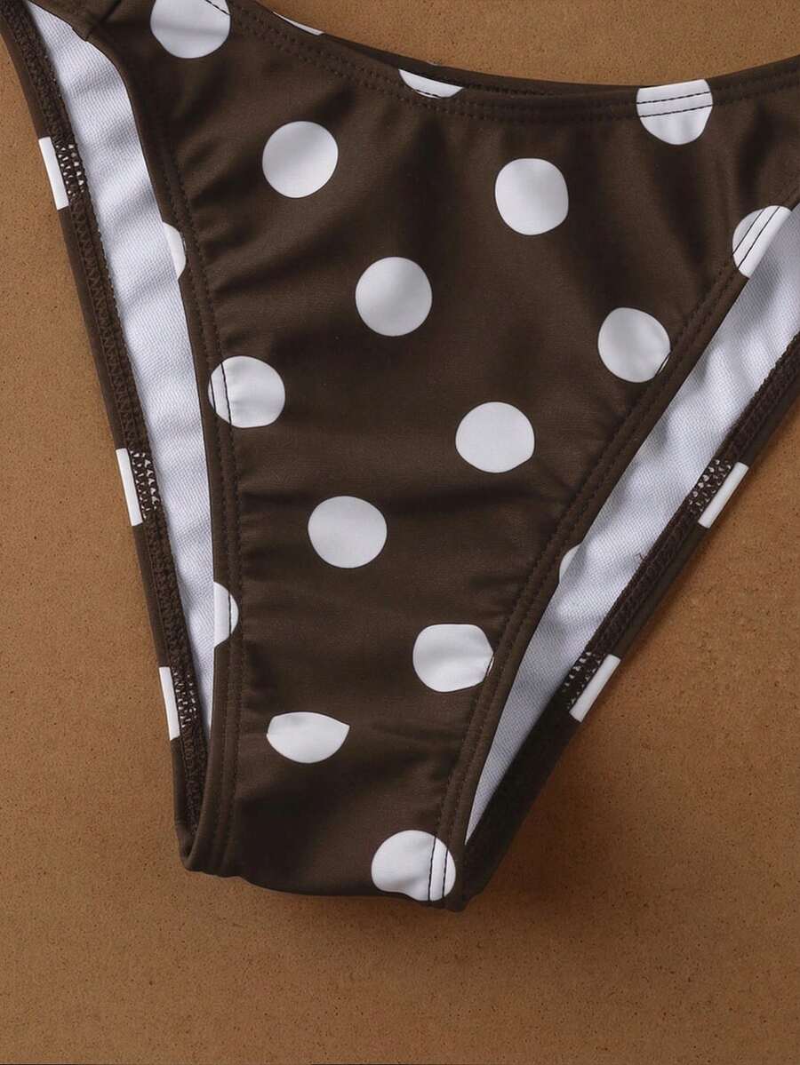 Women's halter neck bikini swimwear set featuring a wireless bra top with removable padding and mid waist bikini bottom.
