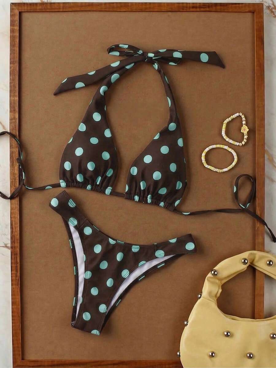 Women's halter neck bikini swimwear set featuring a wireless bra top with removable padding and mid waist bikini bottom.