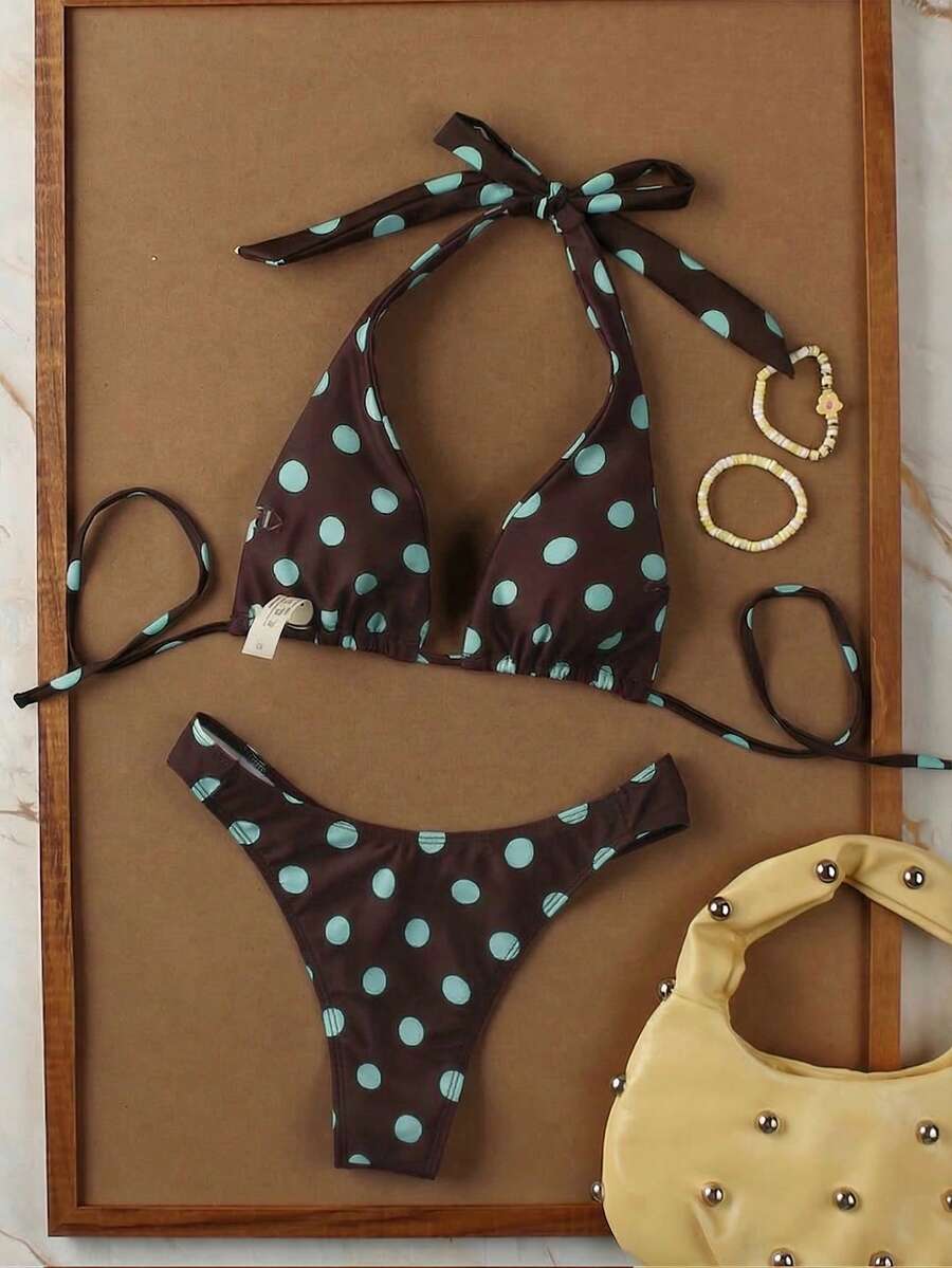 Women's halter neck bikini swimwear set featuring a wireless bra top with removable padding and mid waist bikini bottom.