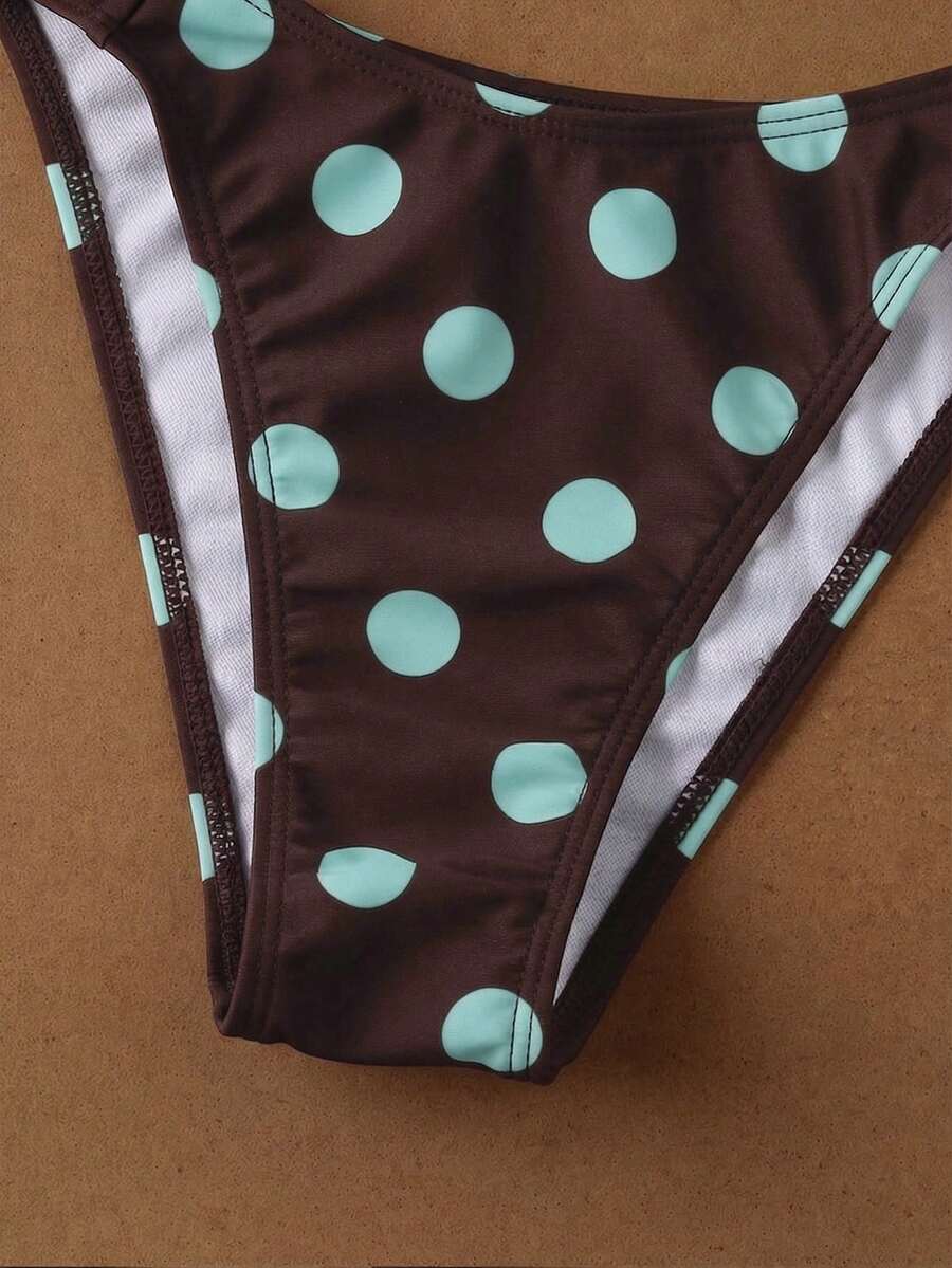 Women's halter neck bikini swimwear set featuring a wireless bra top with removable padding and mid waist bikini bottom.