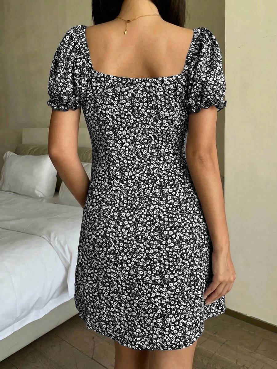 Black floral all-over print midi dress for tween girls featuring puff half sleeves, spaghetti strap neckline, and an A-line silhouette.