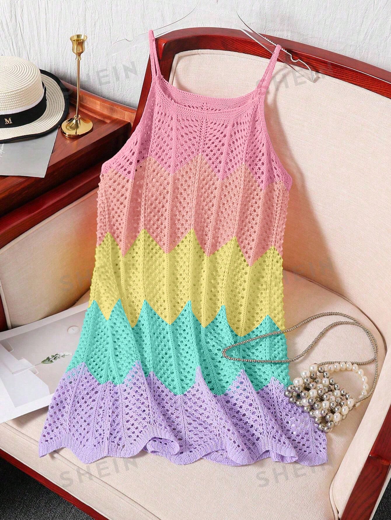 Girls' multicolor rainbow gradient crochet beach cover up with hollow-out knit design, spaghetti straps, sleeveless A-line shape, and semi-sheer finish.
