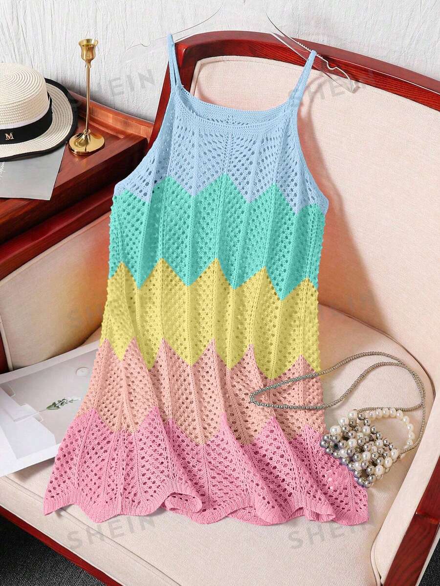 Girls' multicolor rainbow gradient crochet beach cover up with hollow-out knit design, spaghetti straps, sleeveless A-line shape, and semi-sheer finish.
